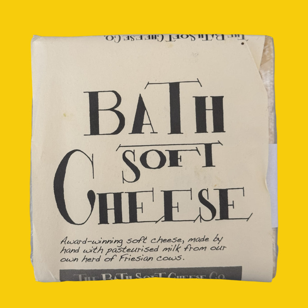 Bath soft cheese on a yellow background