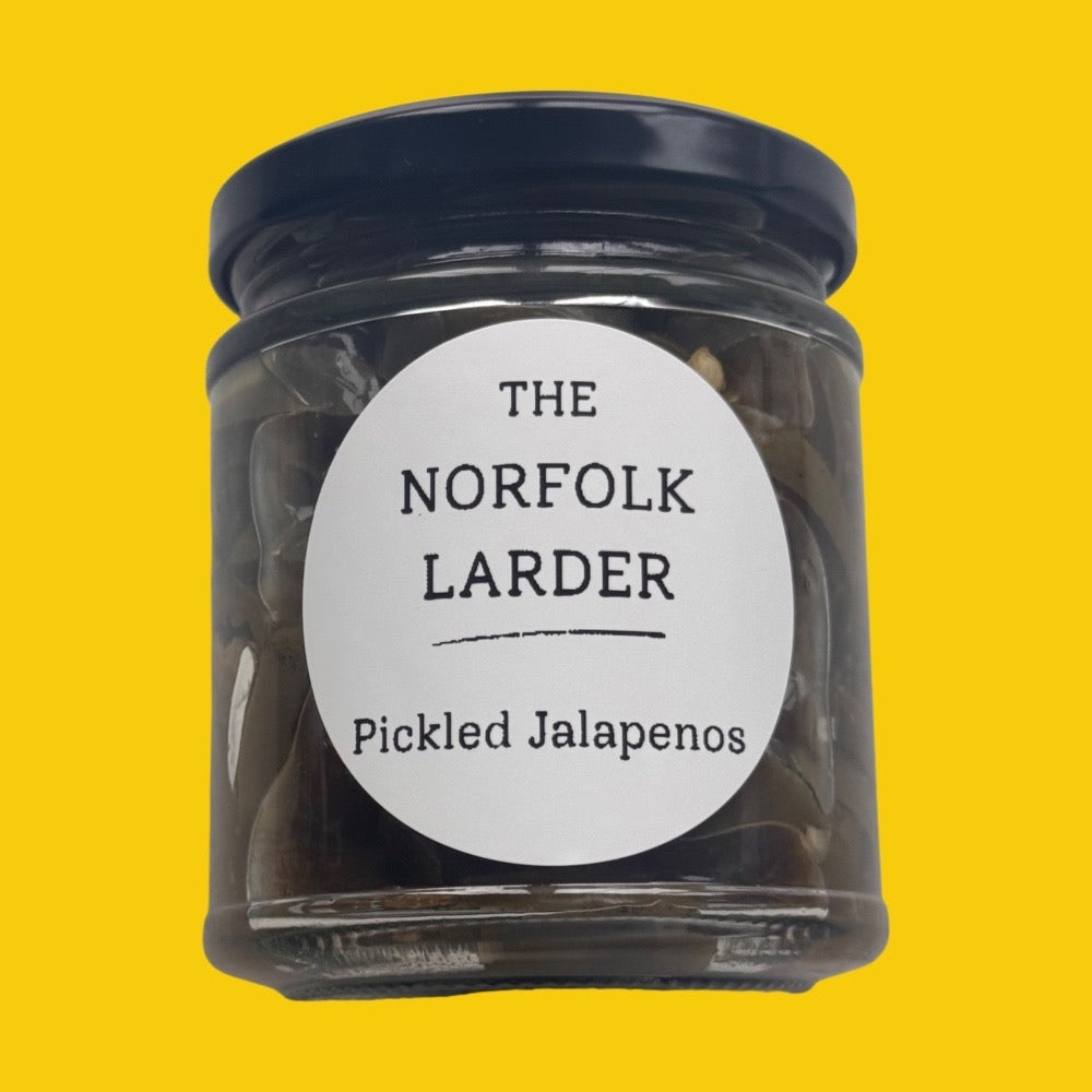 Pickled Jalapeno jar on a yellow background